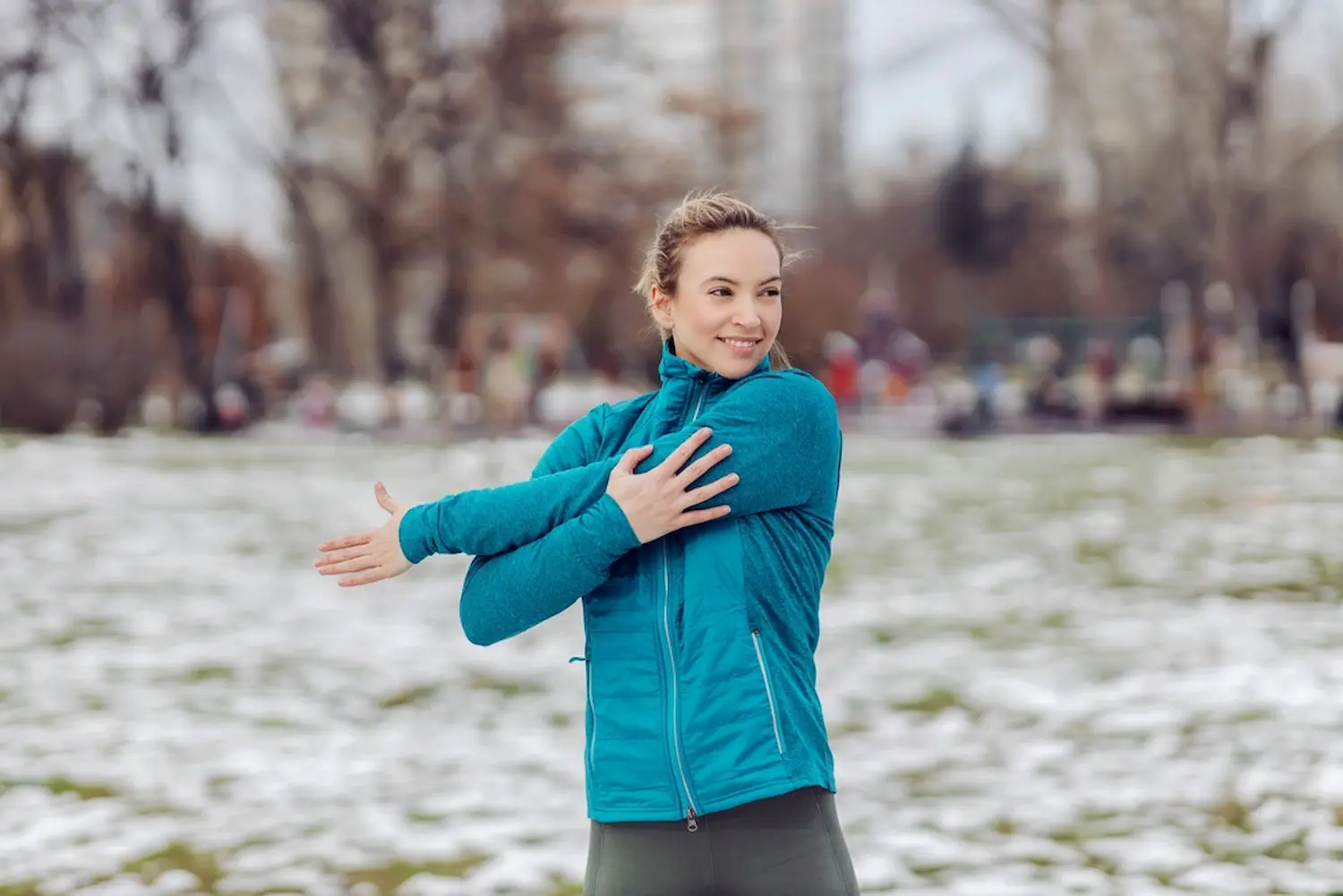 Woman warming up and stretching before exercise
